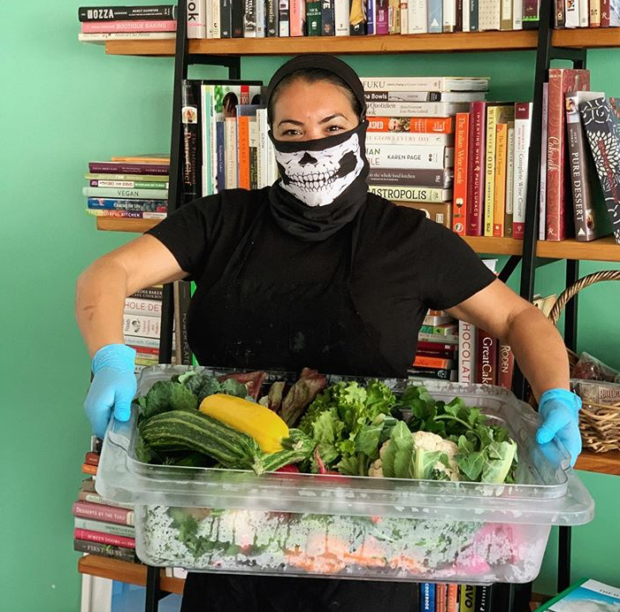 Miranda Gregory of LuckyBolt picks up produce during COVID-19