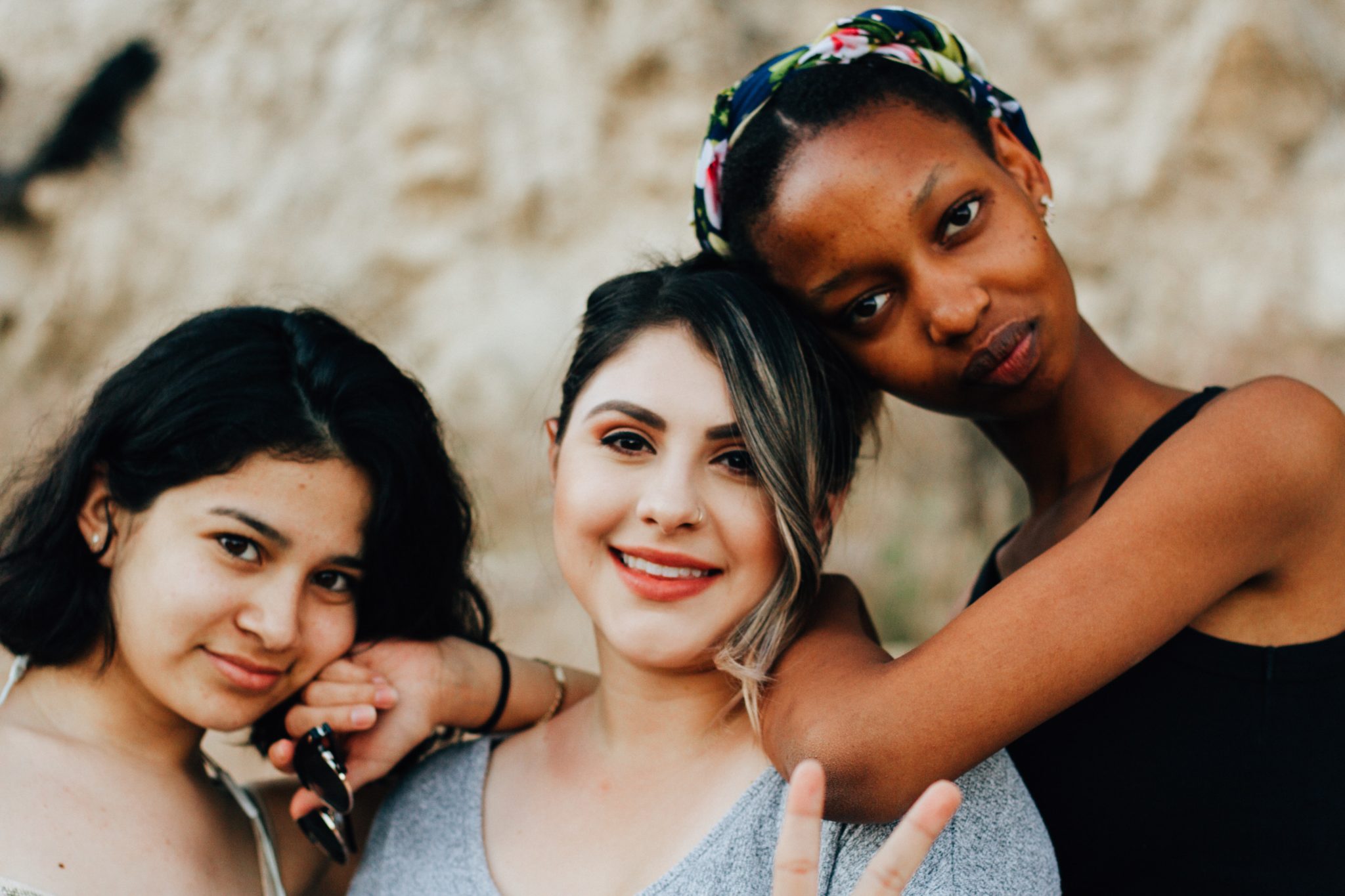 Photo of three women representing immigrants, refugees and New Americans