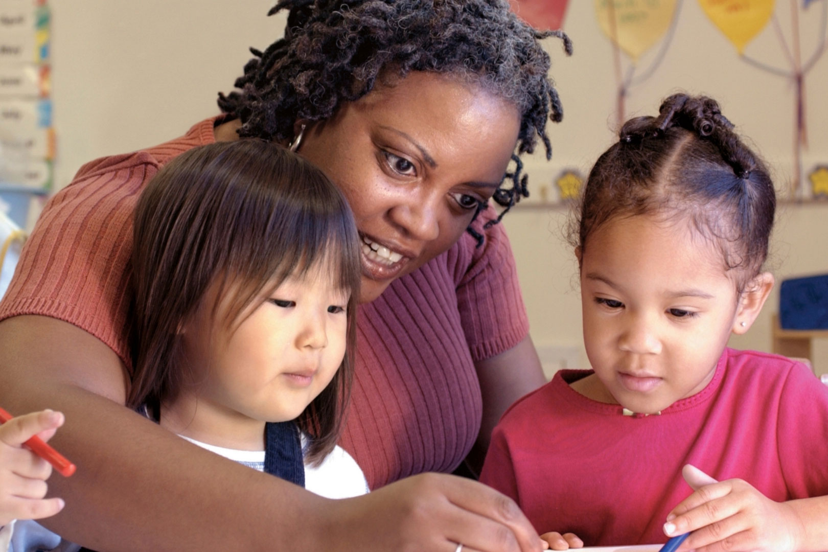 a child care worker with two young kids