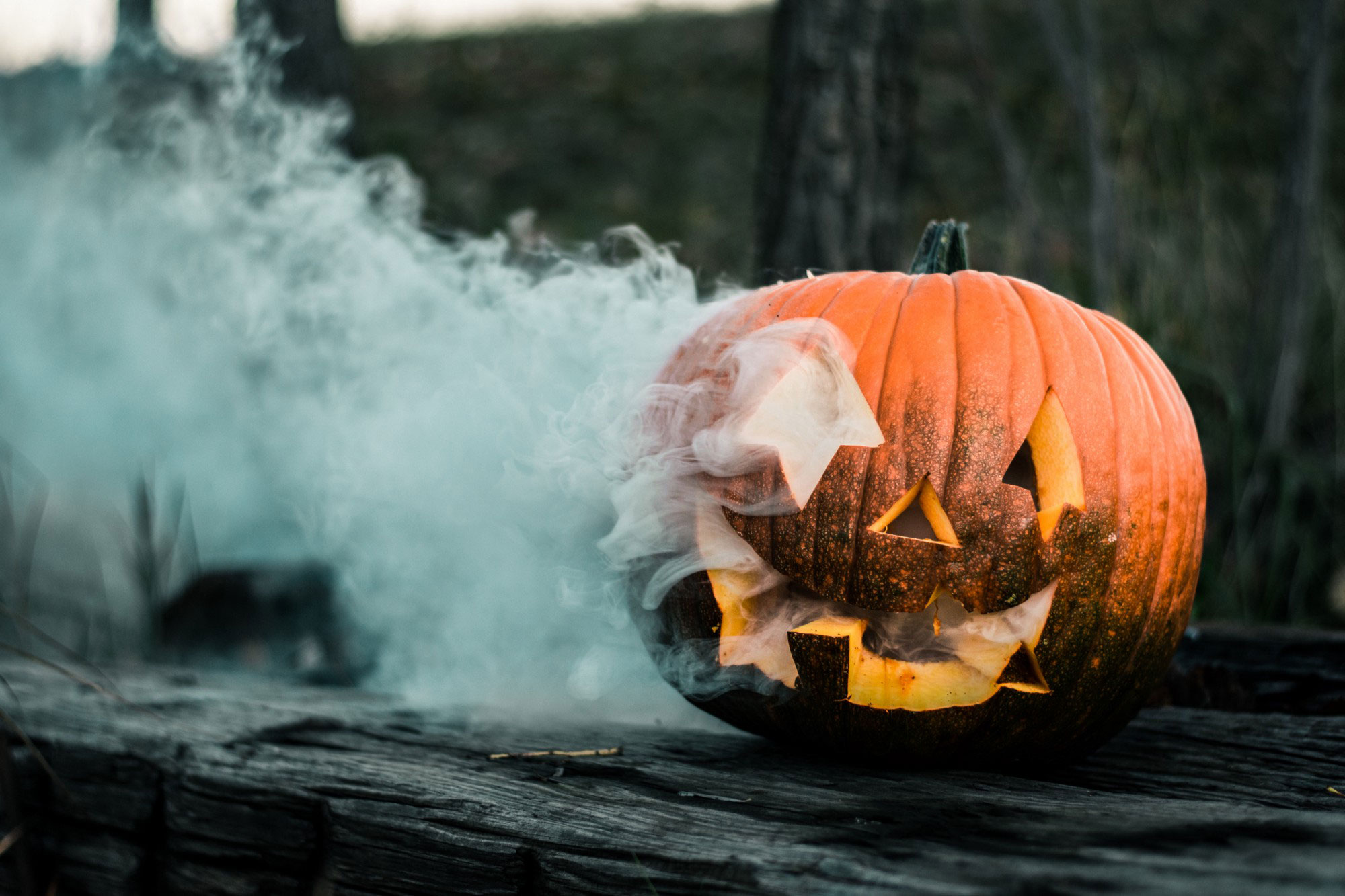 a jack-o-lantern with smoke coming out