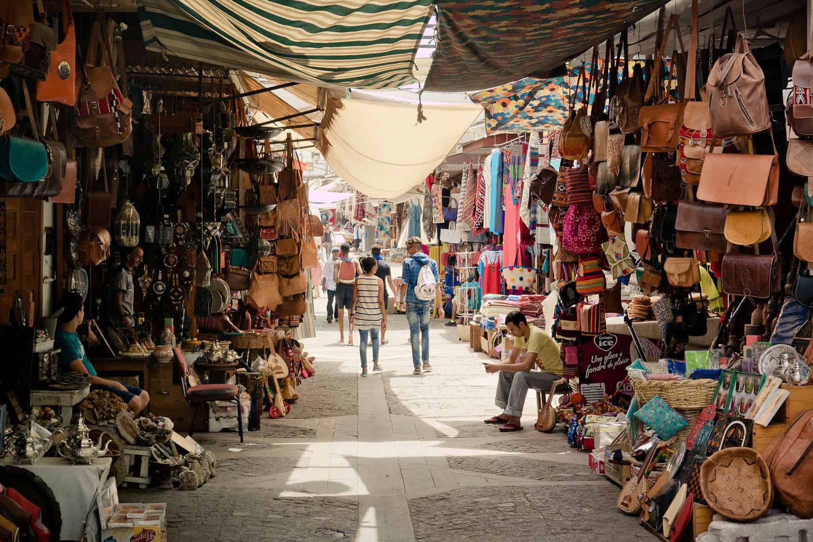 people walking through a middle eastern market