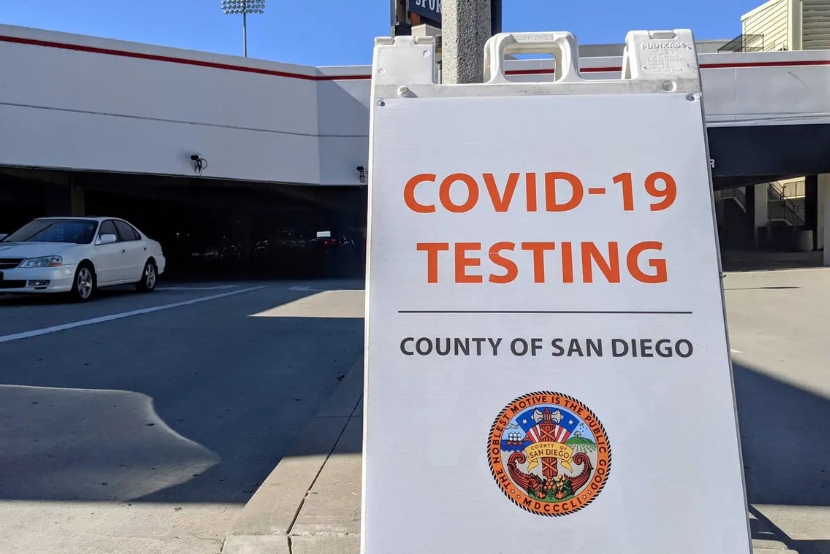 A sign that says "COVID-19 TESTING COUNTY OF SAN DIEGO" in front of a building