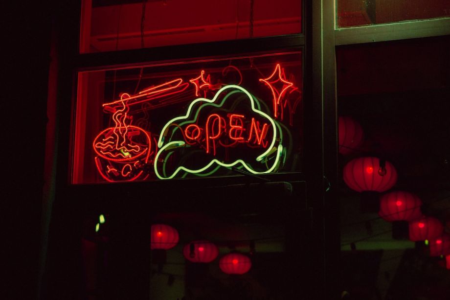 A neon sign that says "open"