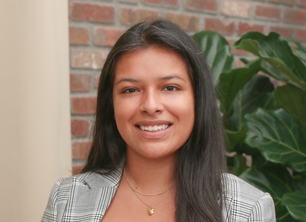 A woman smiles for the camera