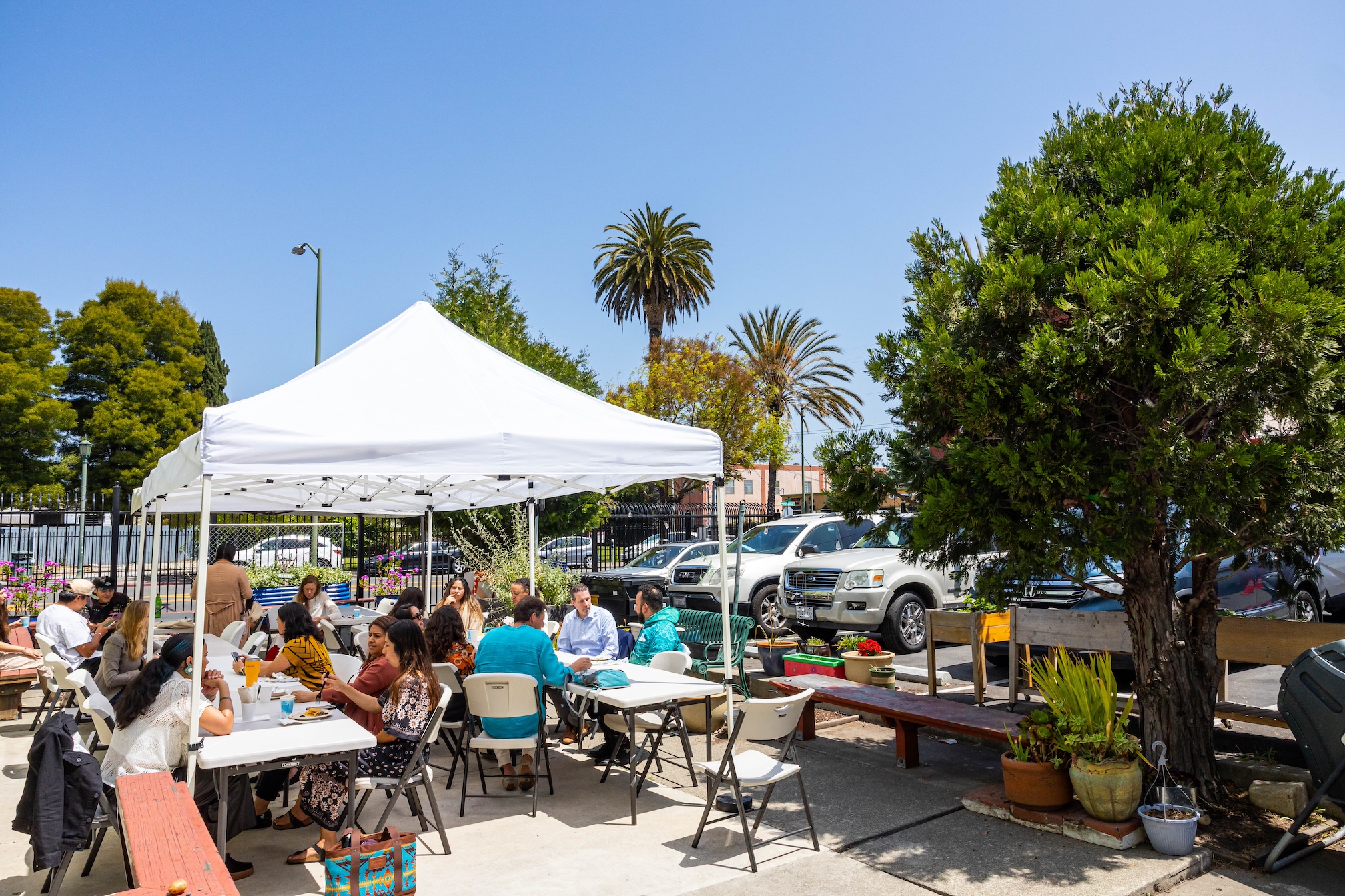 People sitting outside for lunch at "Trading at the Bay"